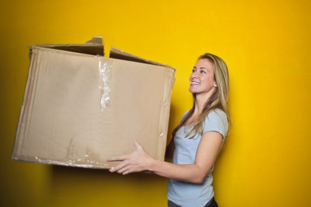 A woman holding a box