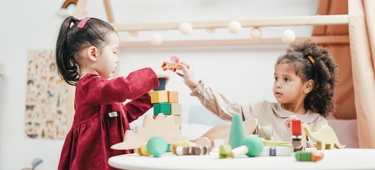 Two girls playing with toys